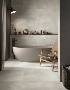 carrelage salle de bain sol mur effet résine béton cire gris ambiance naturelle minimaliste industrielle rénovation appartement Carnon plage